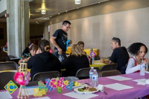 Classified staff having lunch at End of Year Luau