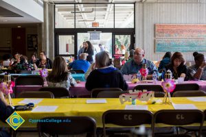 Classified staff having lunch at End of Year Luau