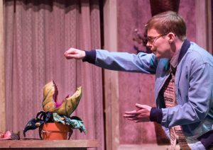 Theater students performing in Little Shop of Horrors.