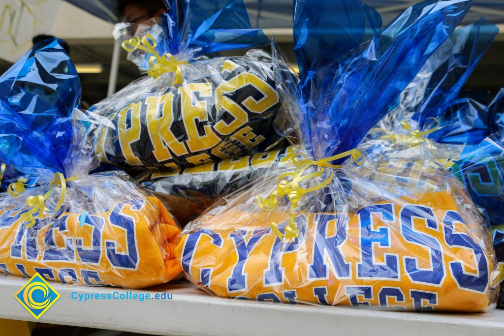 Cypress College shirts in cellophane.