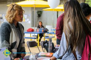 Students at Transfer Fair tables.