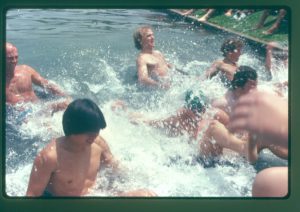 A group of male students participating in the “Duck Pond Races” in the 1970s as a way to exhibit school spirit.