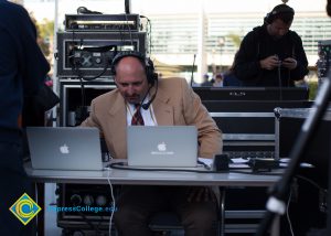 Marc Posner looking at laptop.