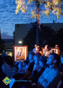 Seated guests listening to Holocaust survivors at the 2016 Yom HaShoah event.