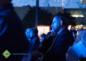 Seated guests listening to Holocaust survivors at the 2016 Yom HaShoah event.