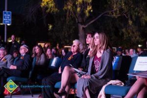 Seated guests listening to Holocaust survivors at the 2016 Yom HaShoah event.