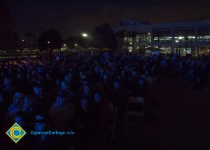 Crowd watching Yom HaShoah event.