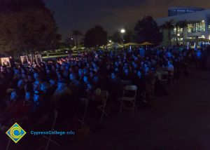 Crowd watching Yom HaShoah event.