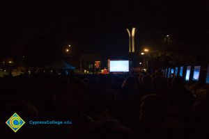 Crowd watching Yom HaShoah event.