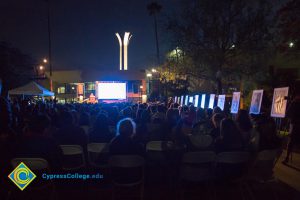 Crowd watching Yom HaShoah event.