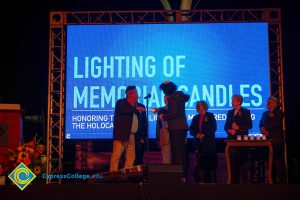 Lighting of Memorial Candles on stage.