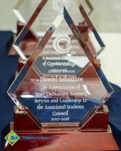 Close-up of Associated Students award for Student Trustee Daniel Sebastian