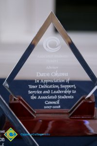 Close-up of Associated Students award for Advisor Dave Okawa