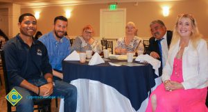 Attendees of Associated Students banquet sitting together at a table