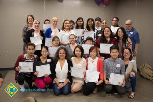 A group of students holding awards.