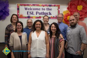 President Bob Simpson with staff and faculty at the ESL potluck.