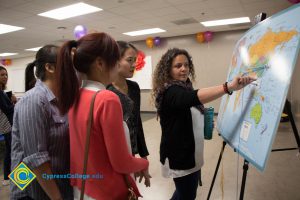 Students looking at the world map.