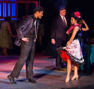 Theater students performing a scene from Grease.