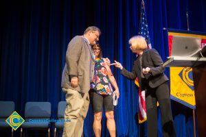 Dr. Schilling, Phil Dykstra and Marsha Jeffredo on stage on Opening Day