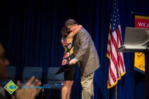 Marcia Jeffredo hugging Phil Dykstra at Fall Opening Day