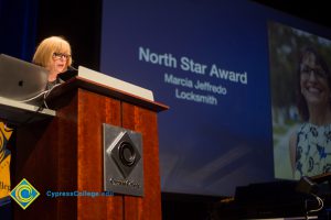 JoAnna Schilling presenting awards at Fall Opening Day.