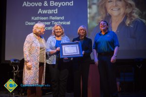 Kathleen Reiland surrounded by Dr. Cheryl Marshall, JoAnna Schilling and Board of Trustee member Jeff Brown.