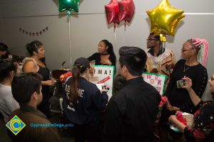 Students talking at 2017 Holiday Celebration.