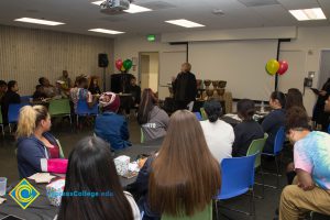 President JoAnna Schilling speaking at the 2017 Holiday Celebration.