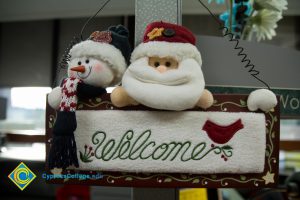Santa and snowman welcome sign.