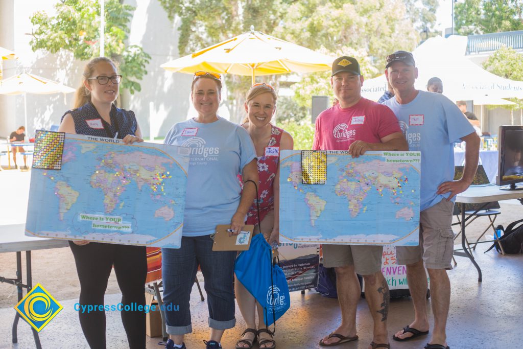 Staff holding maps at Club Rush