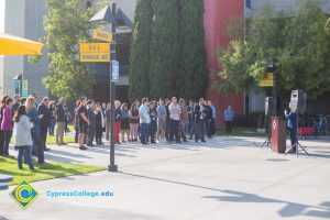 Students and staff standing on campus.