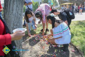 Students grabbing candy after piñata was broken.
