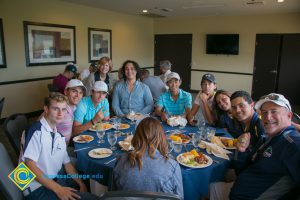 Foundation 2018 Golf Classic attendees at a table smiling.