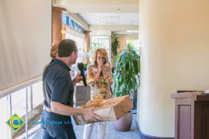 Howard Kummerman presenting Gail Taylor with a gift.