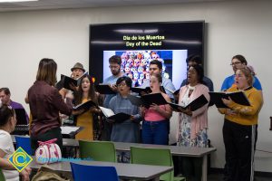 Students singing at Dia de Los Muertos event