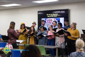 Students singing at Dia de Los Muertos event