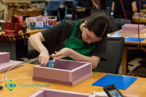 Students working on projects in the Three-Dimensional Design class.