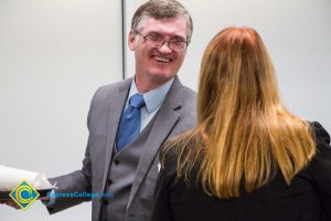 Richard Fee laughing at Superintendent Breakfast.