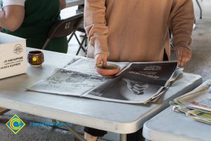 A ceramic bowl being wrapped up at the cup and bowl sale.