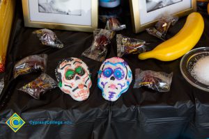 Treats on the ofrenda table for Dia de Los Muertos.