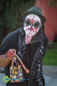 Masked participant in Halloween parade