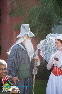 Woman and man in costume for Halloween parade.