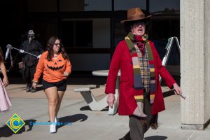 Professor and staff in Halloween garb