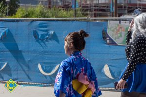 Student in traditional Japanese dress walking outside