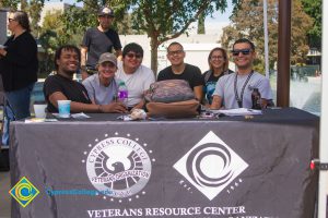 Students sitting at the Veteran's Resource Center table.