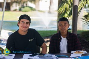 Two students smiling