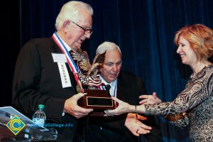 Dr. JoAnna Schilling presenting a man with an award.