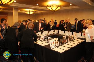 Tables of silent auction items at the 2018 Americana Awards.