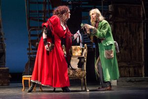 Male and female student acting in Oliver Twist