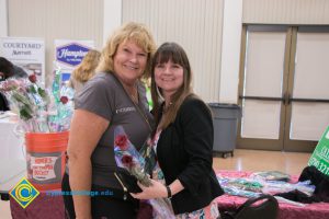 Two women smiling.